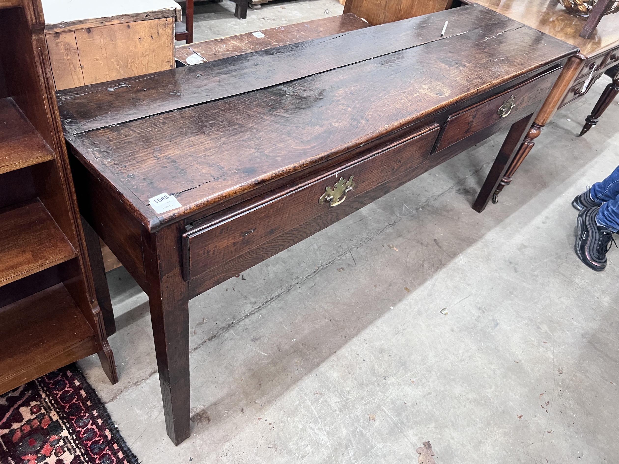 An 18th century oak low dresser, fitted two drawers, width 168cm, depth 45cm, height 78cm